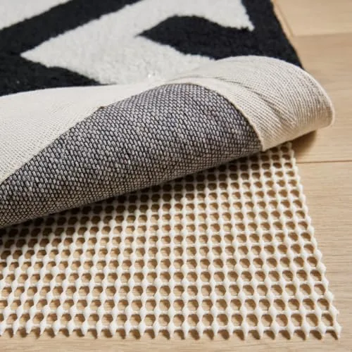 Tuck a Pad Underneath So the Rug Stays Put