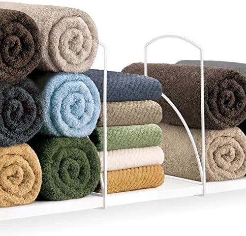 Fold and Stack Towels So the Shelf Holds More Than It Looks Like It Should